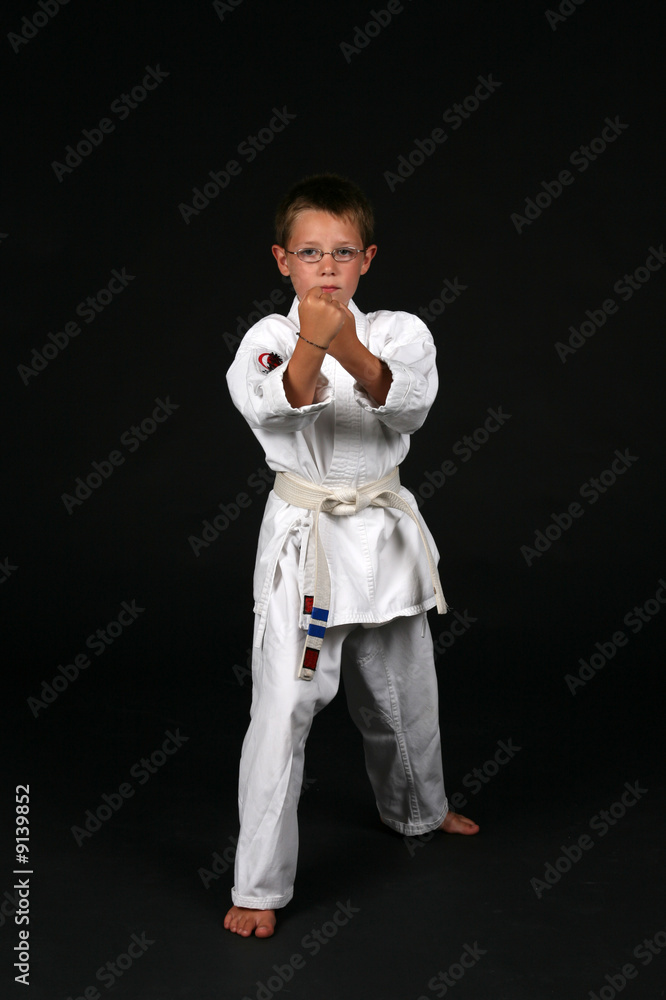 young boy in traditional karate right stance young boy in traditional karate right stance