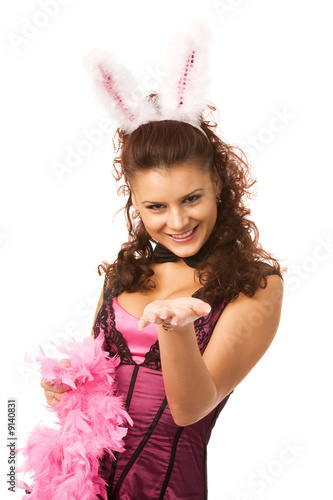 young woman dressed as sexy rabbit on white background