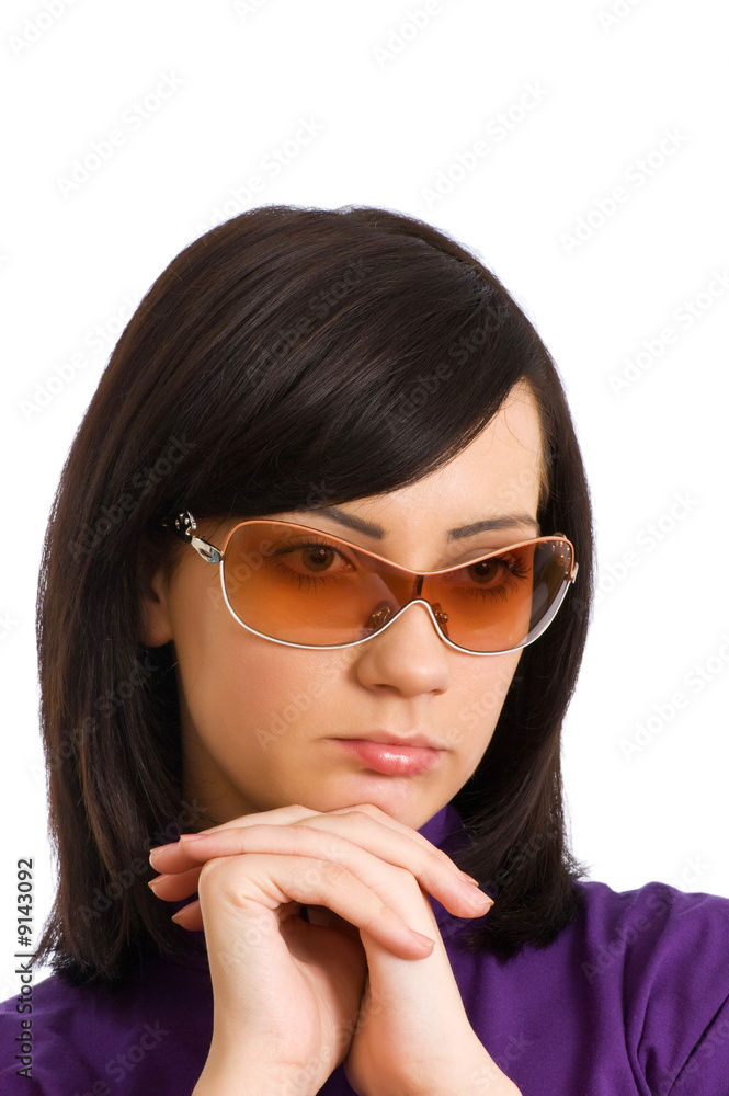 Young girl in sunglasses isolated on the white Young girl in sunglasses isolated on the white