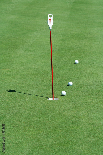 A Practice putting green with golf balls