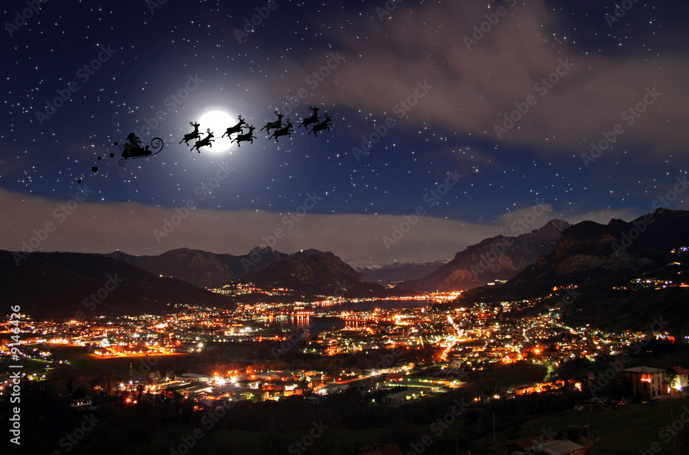 Santa Claus in the Christmas night and city landscape