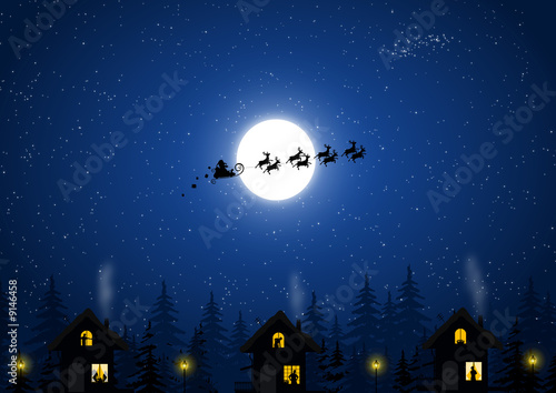 Santa Claus in the Christmas night and houses