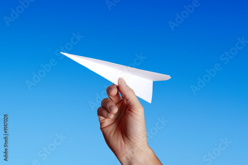 throwing a paper plane..