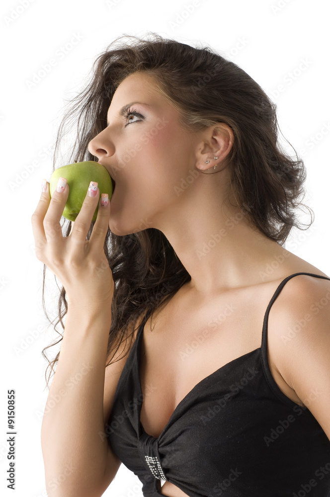 pretty and sensual brunette biting a green apple pretty and sensual brunette biting a green apple