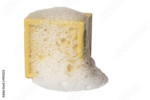 Square block of natural soap isolated against white background