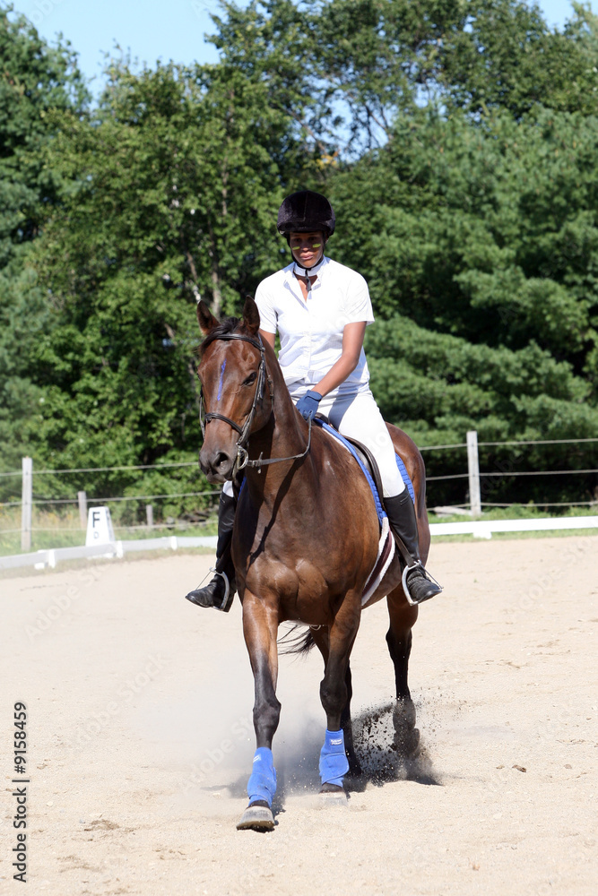 teen on dark horse at show