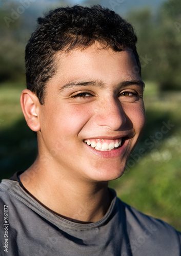 Portrait of a young guy smiling in rural setting