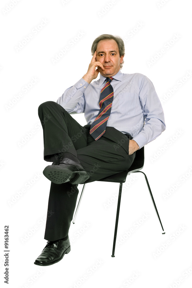 mature businessman on a chair, isolated on white mature businessman on a chair, isolated on white
