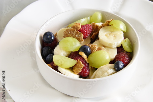 bowl of cereal with lots of  fresh fruit