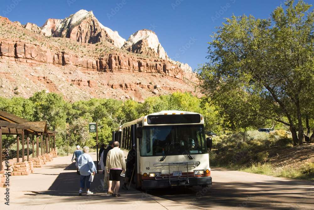 A porpane fueled shuttle bus stops at the  Zion Visitor's Center