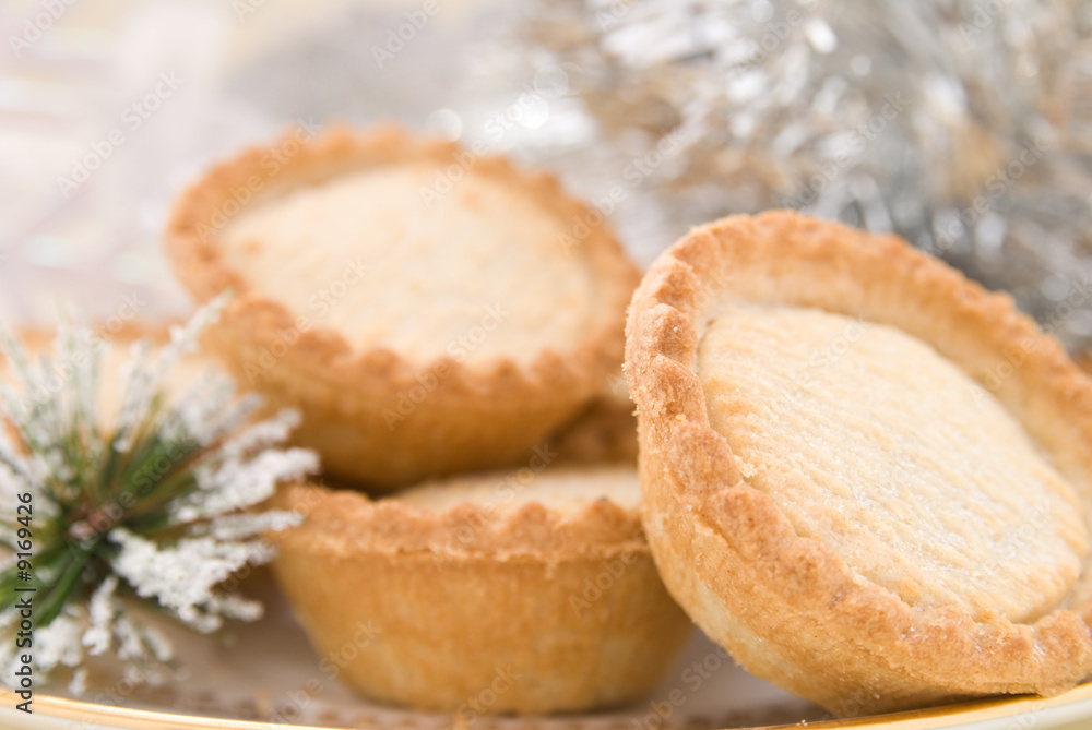 Traditional Christmas mince pies with silver tinsel