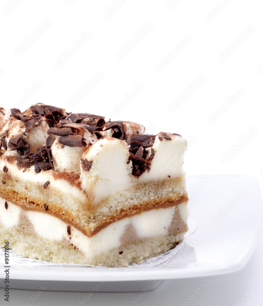 Chocolate Cake on a Plate Isolated on White Background Chocolate Cake on a Plate Isolated on White Background