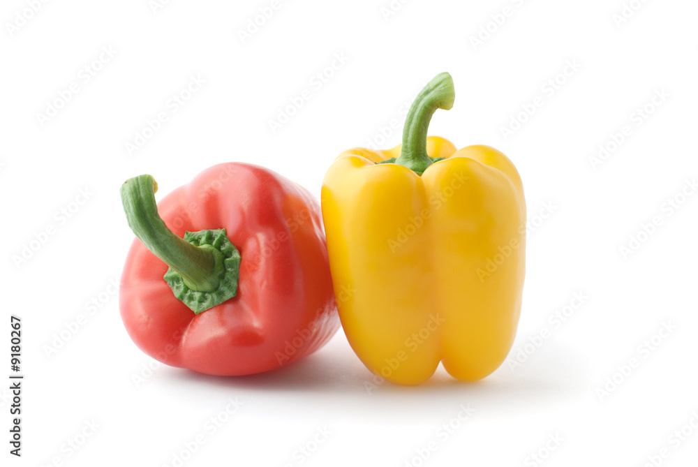 Fresh red and yellow peppers . Isolated over white Fresh red and yellow peppers . Isolated over white