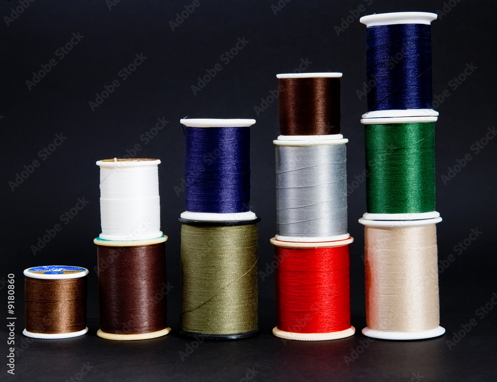 Five stacks of multi-color thread Five stacks of multi-color thread