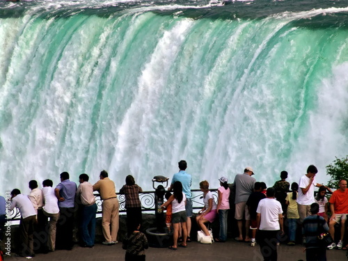 Fotografiet People on falling water background. Niagara Falls