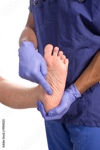 Doctor podiatrist checking patients foot