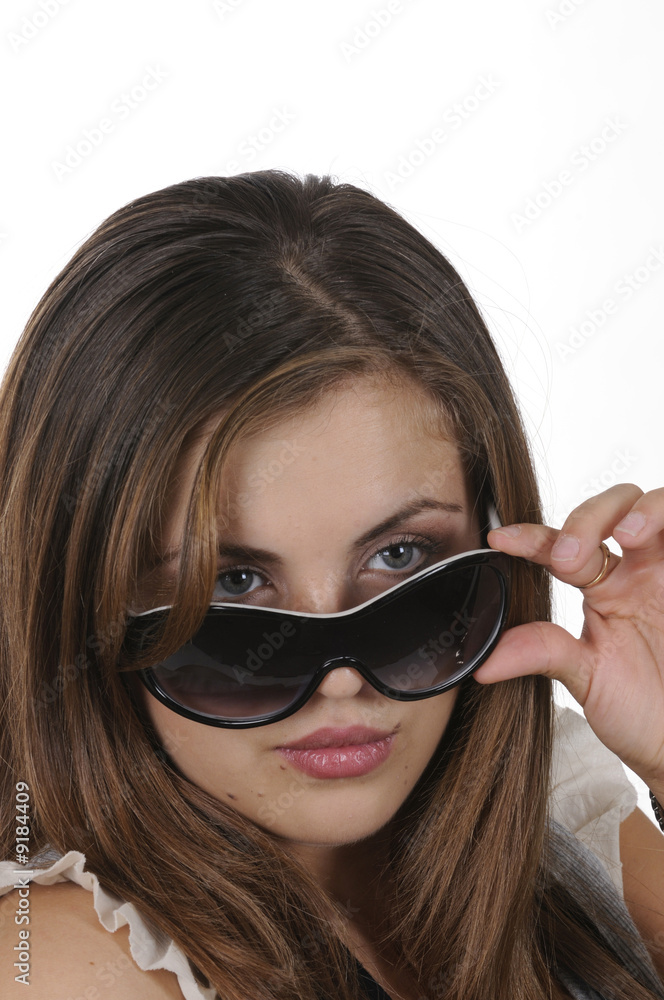 closeup of pretty hispanic model looking over sunglasses closeup of pretty hispanic model looking over sunglasses