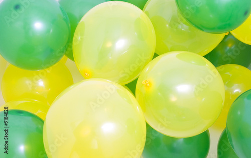 Many green and yellow balloons background
