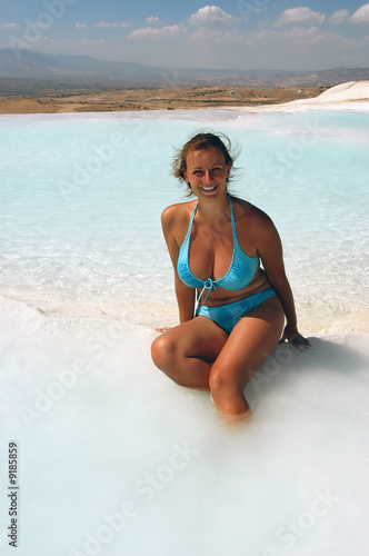 Attractive female enjoying in fresh water, Pamukkale, Turkey