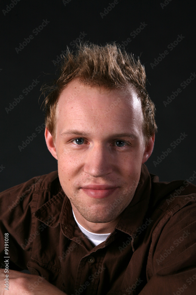 confident young man with hair up confident young man with hair up