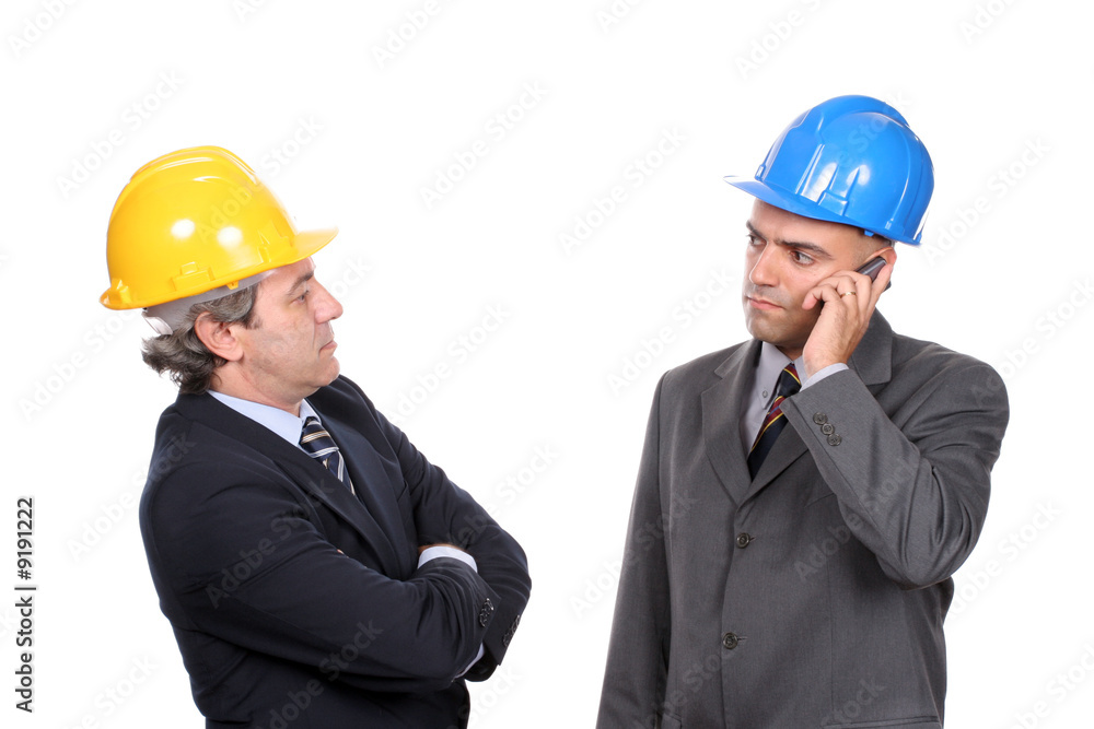 Two Engineers or Architects, on the phone, isolated in white Two Engineers or Architects, on the phone, isolated in white