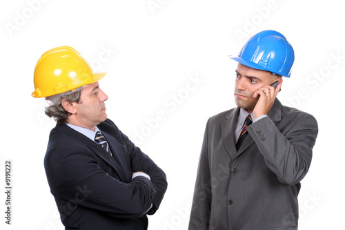 Two Engineers or Architects, on the phone, isolated in white