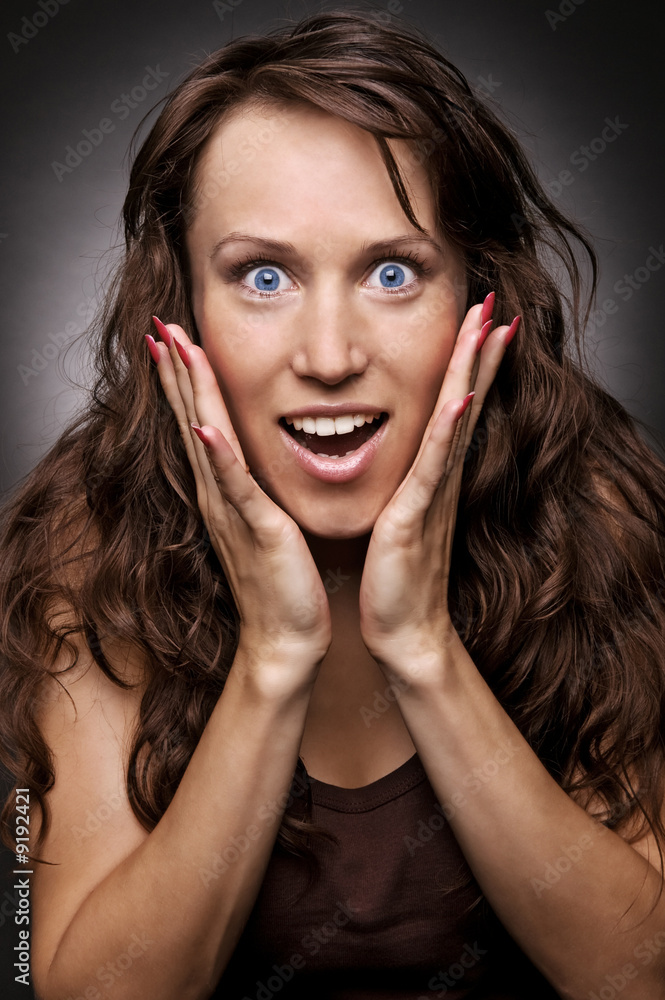 surprised woman with hands on her cheeks surprised woman with hands on her cheeks