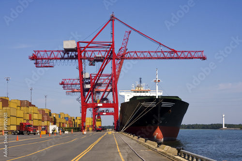 Giant container crane unloading a ship in a major port.