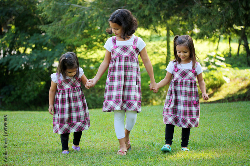 Sisters Outside Their Home ...