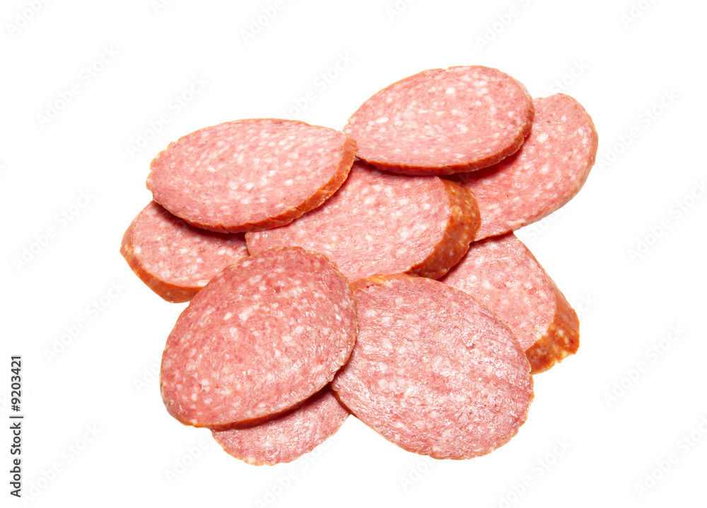 Bits of summer sausage isolated on white. Bits of summer sausage isolated on white.