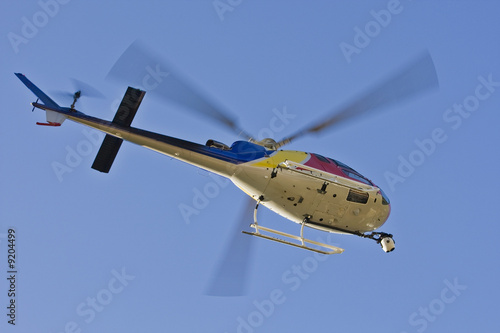 A helicopter with a camera. A motion blur on rotor blades