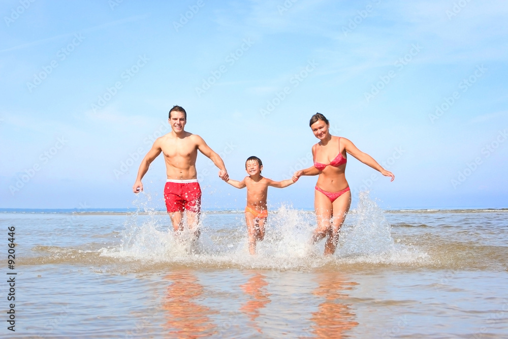 happy family having fun on the beach