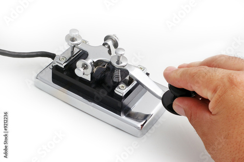 vintage morse telegraph key with white background