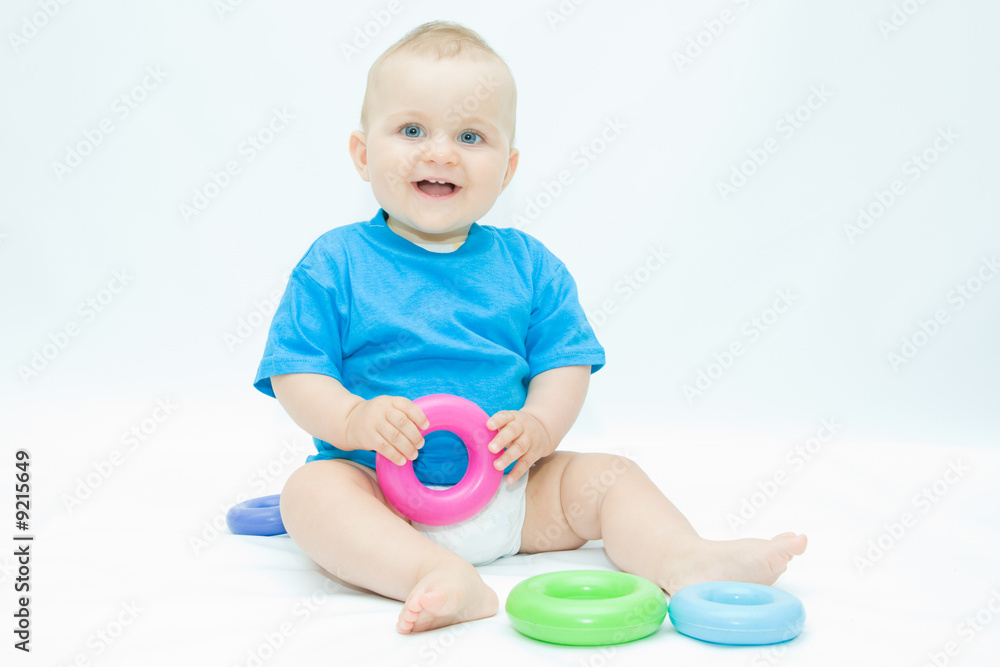 cute baby boy playing with colorful toys cute baby boy playing with colorful toys