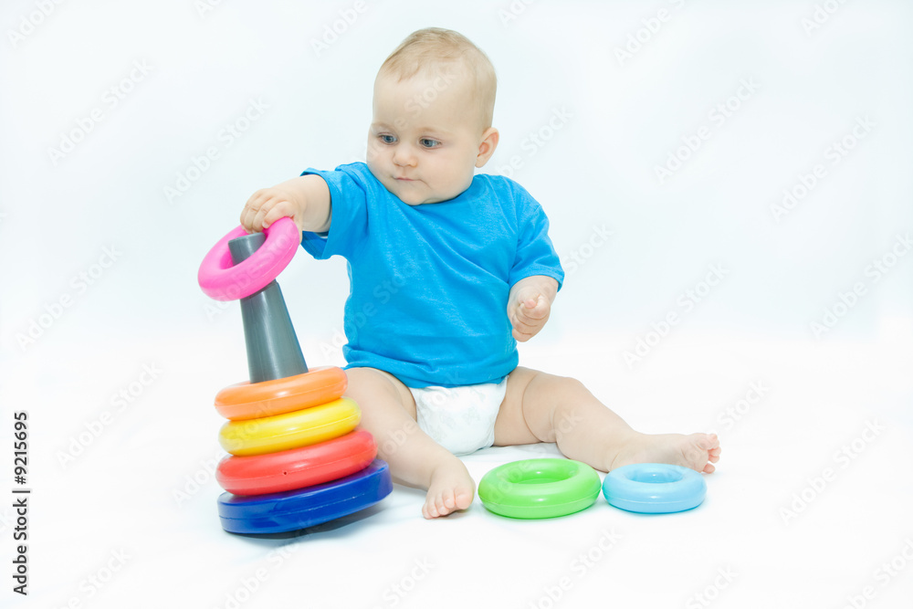 cute baby boy playing with colorful toys cute baby boy playing with colorful toys