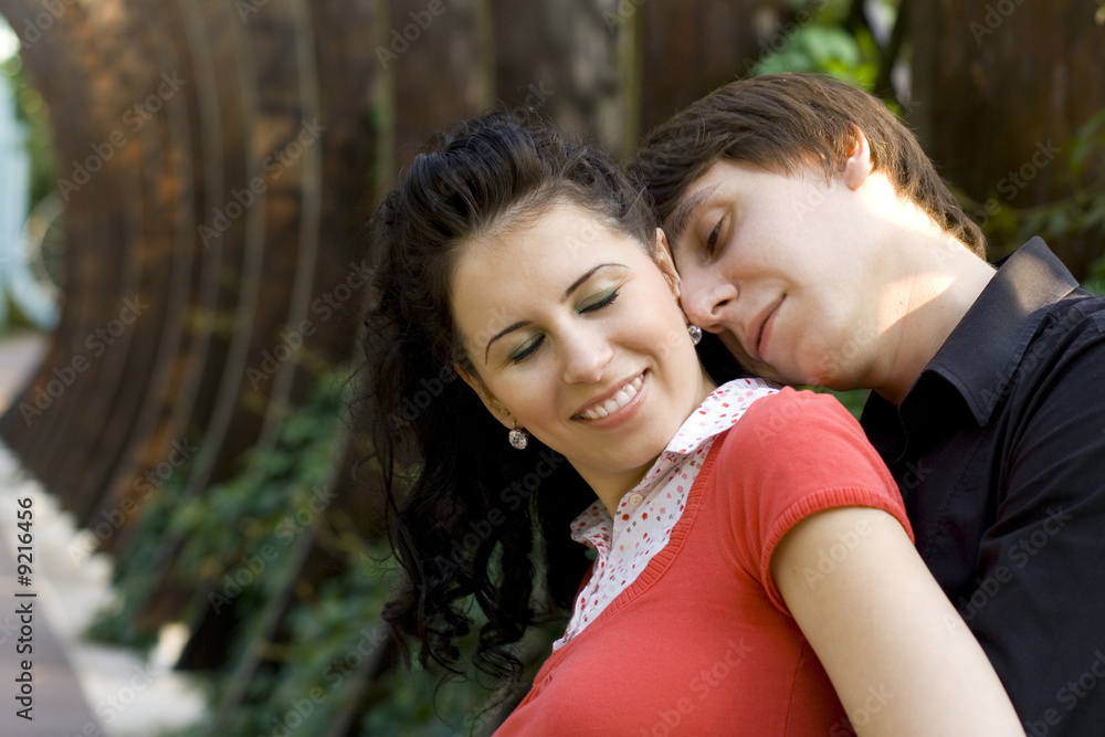 happy young couple in the park happy young couple in the park
