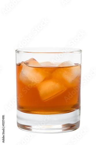 Glass of whisky with an ice on a white background