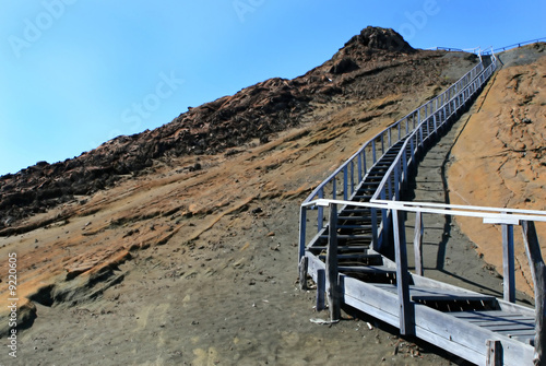 Wooden stairs lead to the top of a mountain