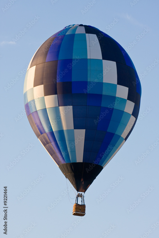No one onboard Colorful hot air balloon mid-air on a clear day No one onboard Colorful hot air balloon mid-air on a clear day