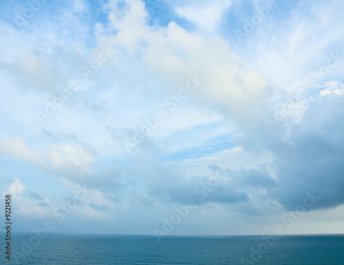 Cloudy blue sky and turquoise ocean