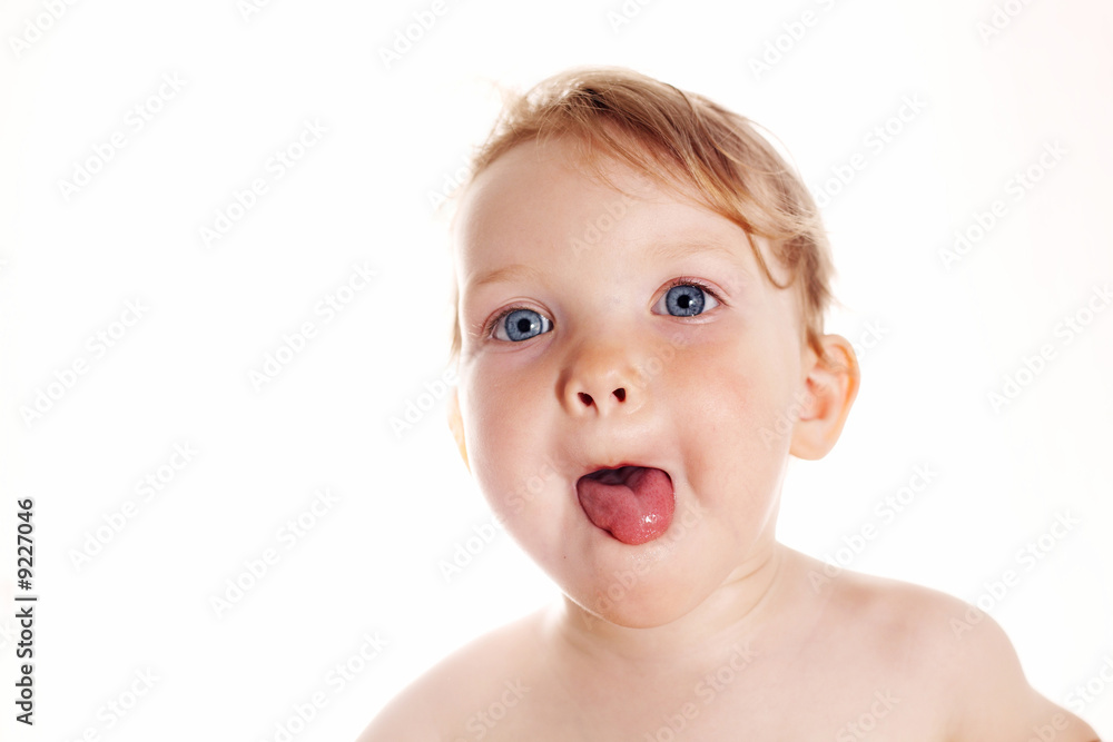 An image of a baby-girl showing her tongue An image of a baby-girl showing her tongue