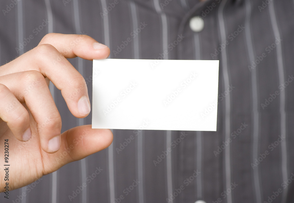 Blank business card held in hand by business person Blank business card held in hand by business person