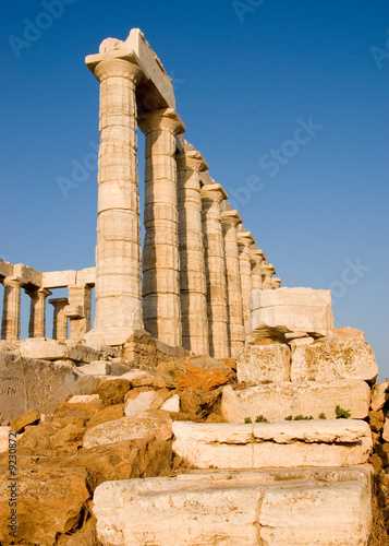 Temple of Poseidon at the very tip of cape Sounio in Greece photo