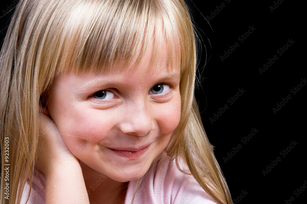 Blond Girl with big blue eyes on a black background Blond Girl with big blue eyes on a black background