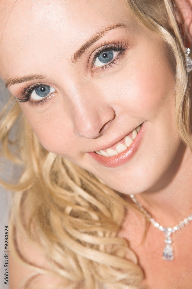 Beautiful Blond bride wearing diamond jewelery