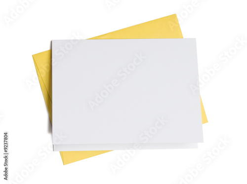 Blank greeting card on top of colored envelope