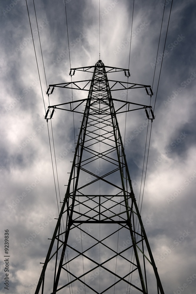 Electric pillar against dramatic sky