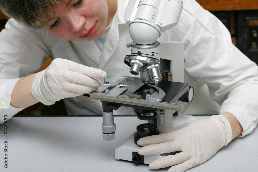 Scientist and microscope Scientist and microscope