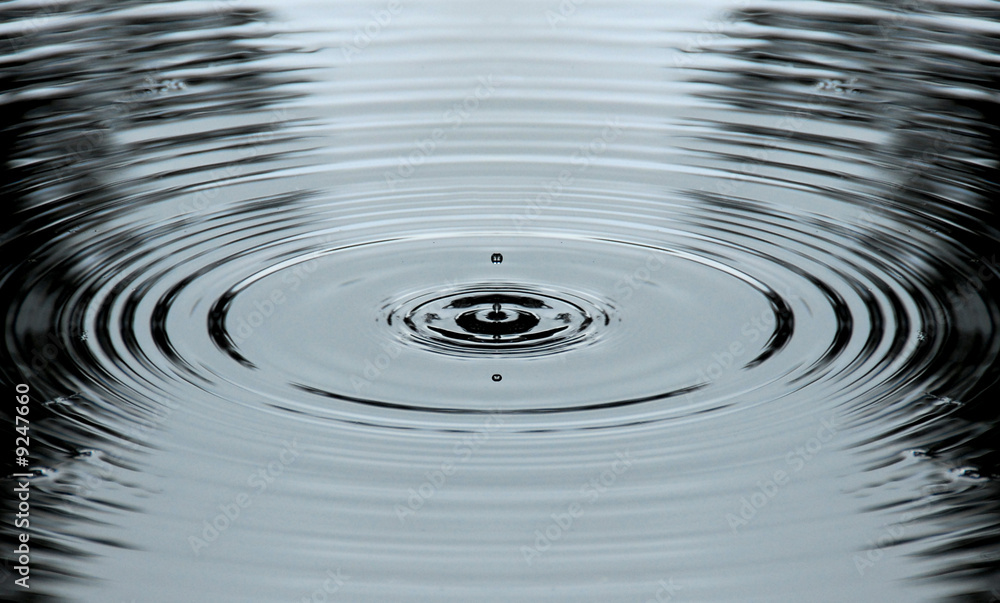 Drops of water into pond making rings Drops of water into pond making rings