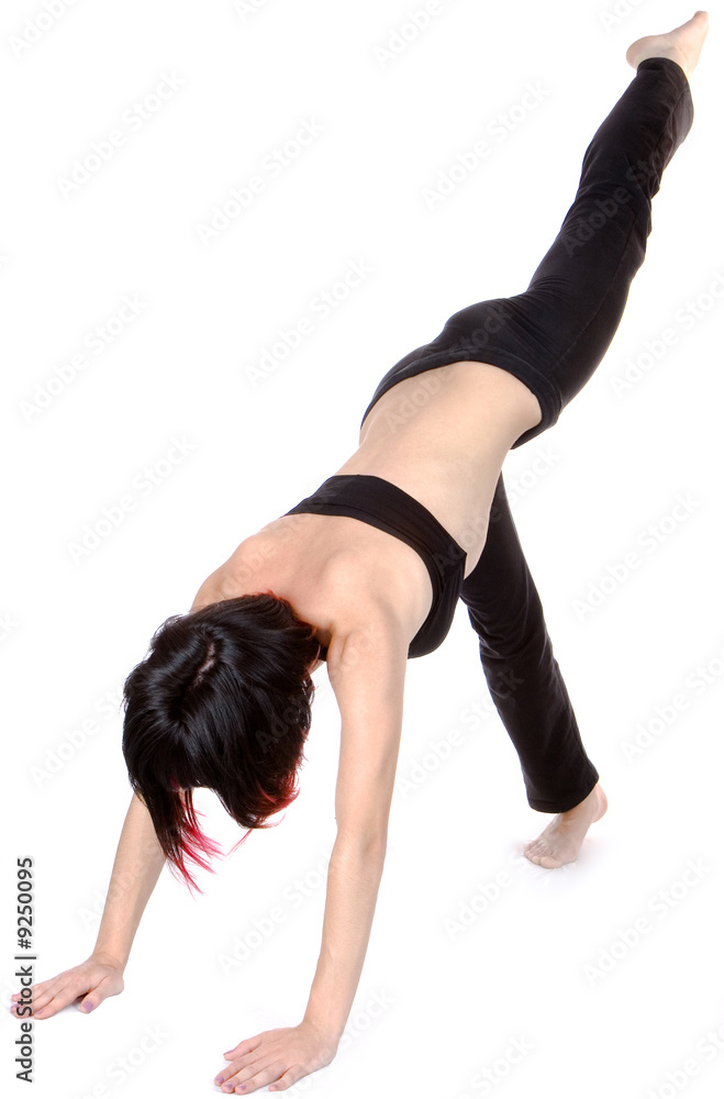 Young woman doing floor exercise, studio shut